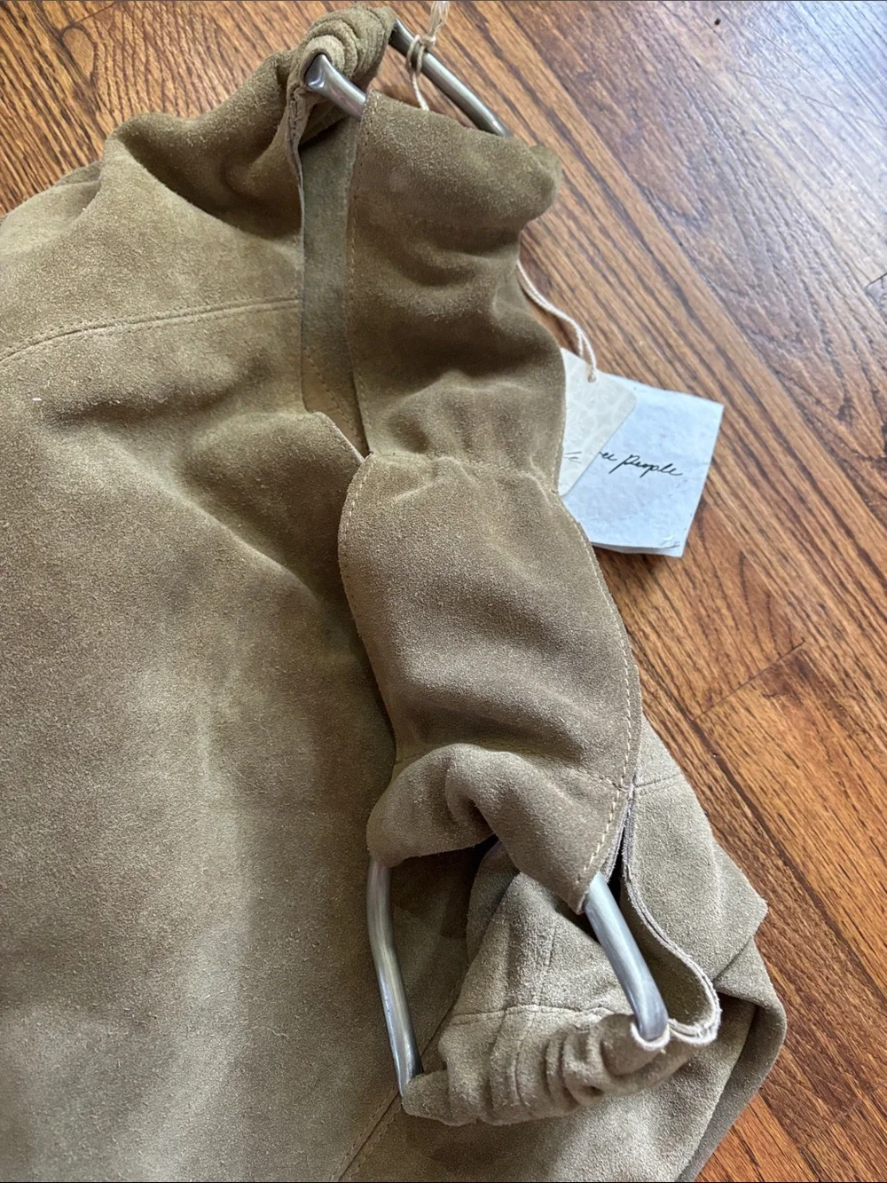 NWT Free People real suede leather bag with metal accents . Light sand color